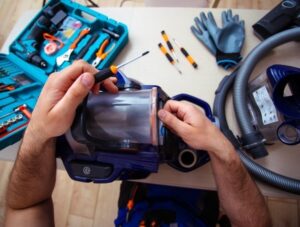 man repairing vacuum - vacuum repair Richland OH